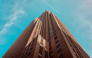 Upward looking perspective at a tall office building